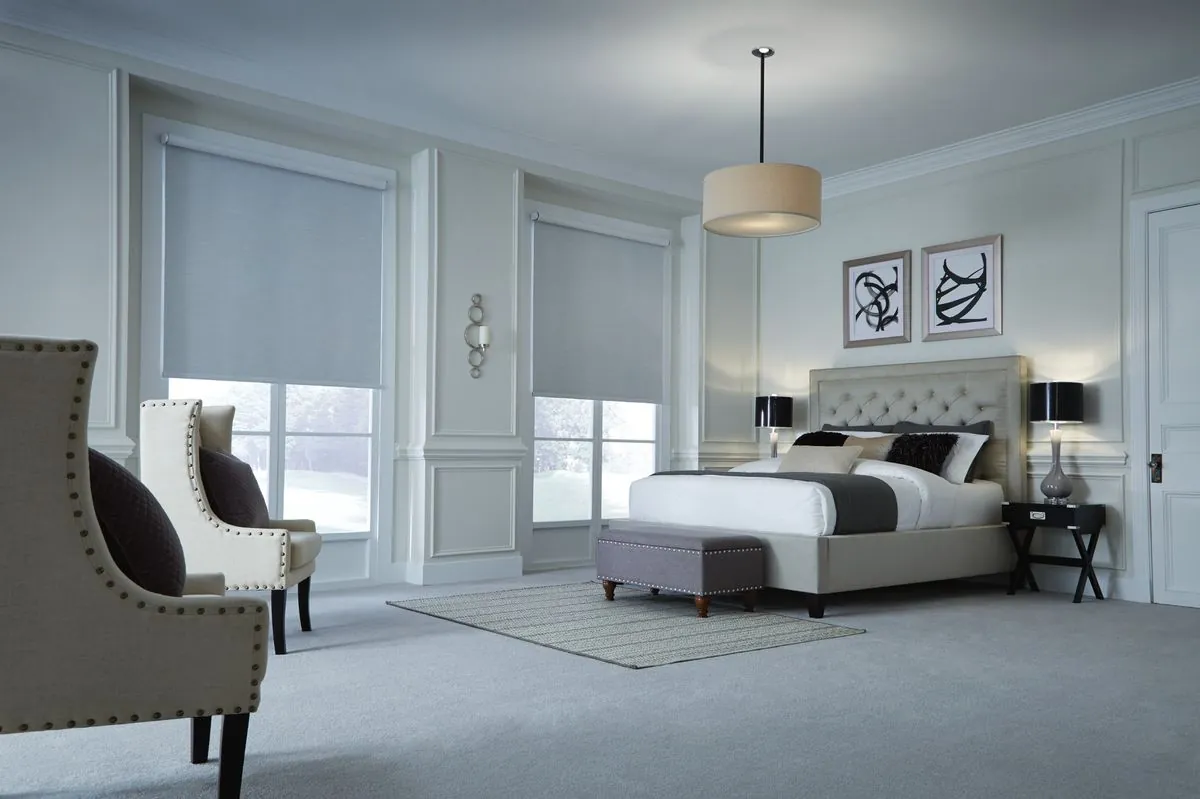 Lutron Palladiom motorized shades integrated in luxury bedroom