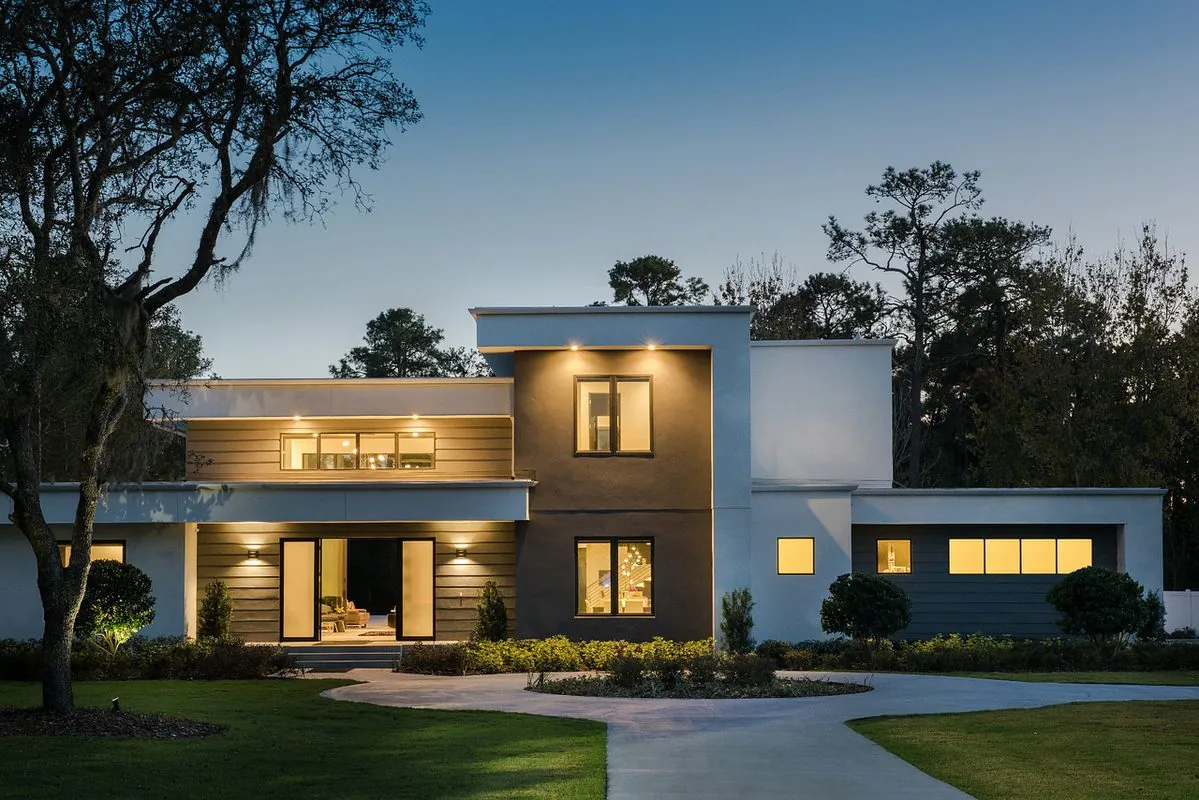 Wadden Electric project — luxury home exterior at dusk with integrated security and landscape lighting