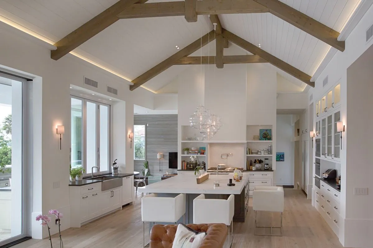Lutron Ketra tunable warm dim lighting in vaulted-ceiling luxury kitchen